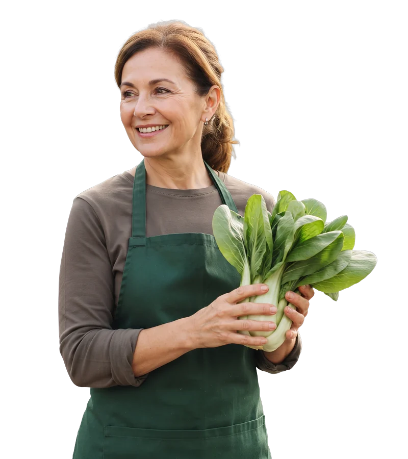 Mitarbeiterin des Marktes mit frischem Pak Choi